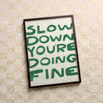 Quadro decorativo Slow down you're doing fine (verde) com moldura preto
