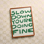 Quadro decorativo Slow down you're doing fine (verde) com moldura freijó